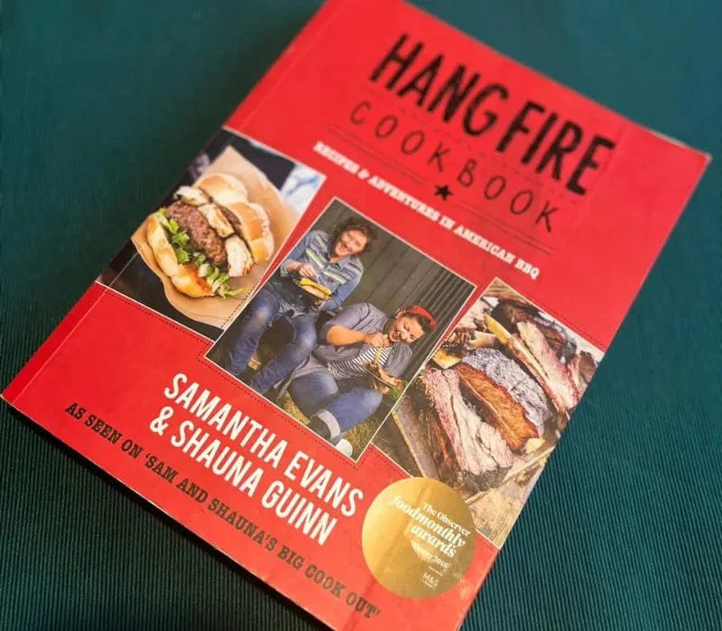 Red cover of Hang Fire Cookbook featuring American BBQ recipes by Samantha Evans and Shauna Guinn