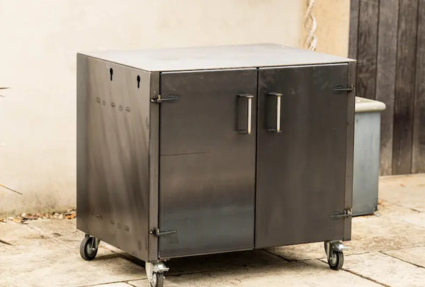 Gunmetal grey metal worktop unit with two doors and caster wheels for mobility